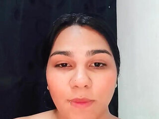 Sensual Brunette Puts Oil All Over Her Body