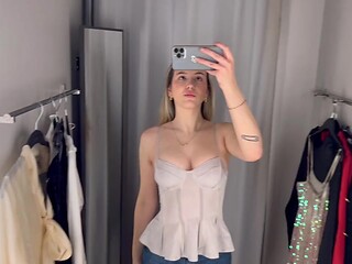 Sexy babe tries on see-through dresses and reveals big tits in the dressing room
