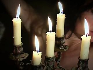 Gypsy witch's natural big tits on display as she's tormented by hot wax