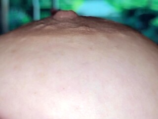 Close-up of big nipple glistening with saliva