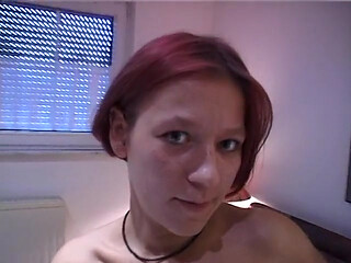 Redhead teen rubs and fingers her wet twat
