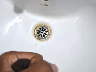 Peeing while jerking in bathroom